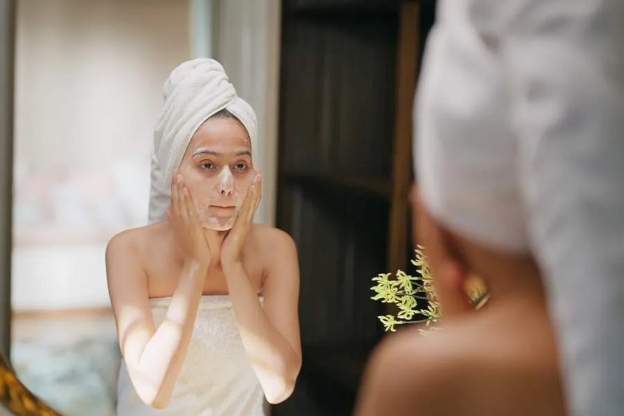 young woman using skin care